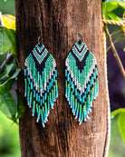 Green handmade beaded fringe earrings with intricate design – boho-style statement earrings by Jenni and Janki